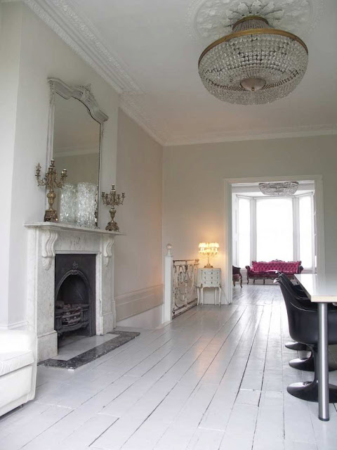 A shot of hot pink in a white room - seen from a distance