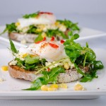 Goat cheese, arugula and poached egg open sandwich