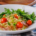 Pasta with ham, cherry tomatoes & arugula