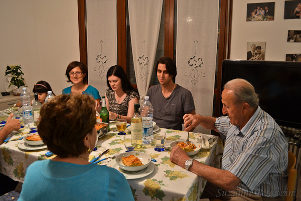 Family eating lasagna