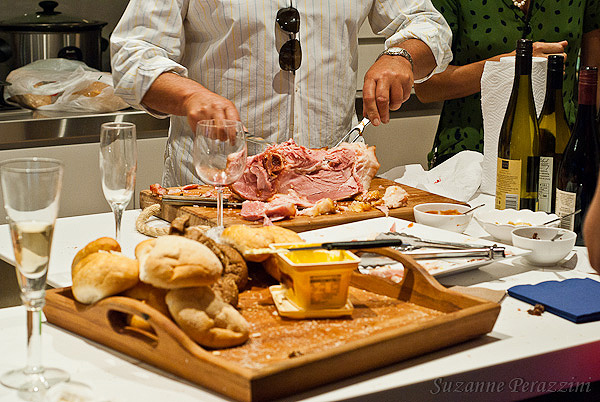 Cutting the ham for the late night sandwiches Cutting the ham for the late night sandwiches