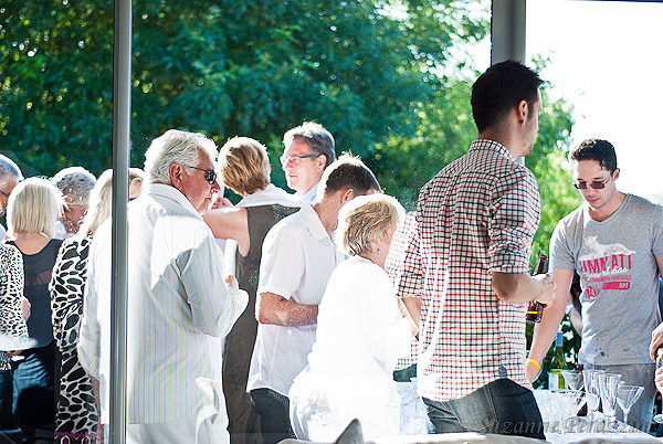 Guests clustered around the bar on the balcony