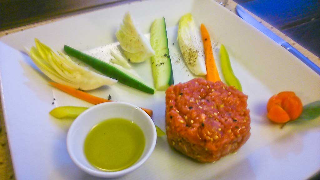 Steak Tartare and low Fodmap veggies at an open air restaurant near Montalcino