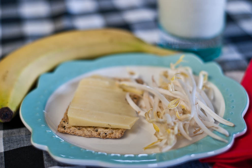 Afternoon Snack: Cracker, hard cheese, sprouts, banana and milk